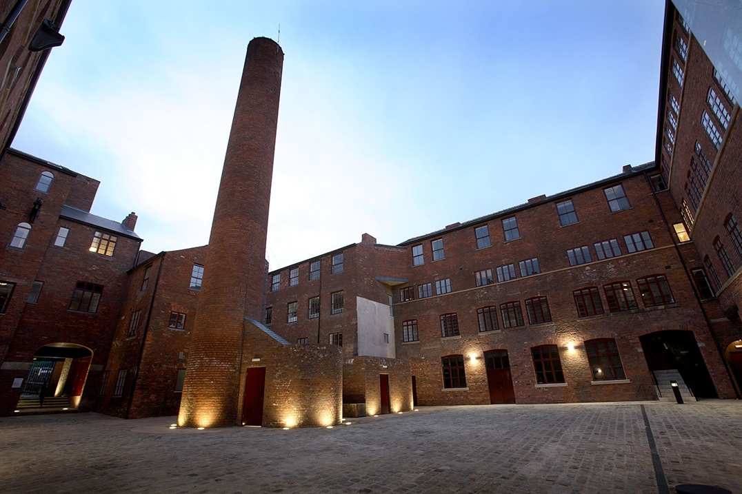 Exterior lighting enhancing brick architecture at Butcher Works